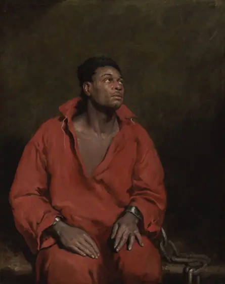 Painting of a dark-skinned man seated and wearing a red open-necked tunic. He looks up to the right. His wrists are shackled and a large chain rests at his right, running down the bench he sits upon.