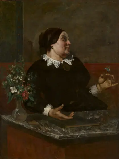 Dark portrait of older woman in black dress with lace collar, flowers.