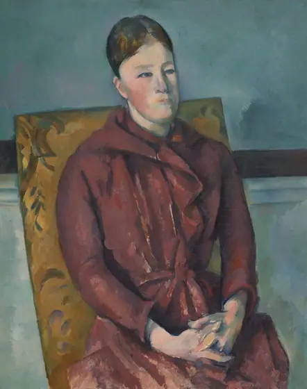 Painting of a placid-looking, light-skinned woman in a maroon dress, seated in a chair with yellow upholstery, hands folded.