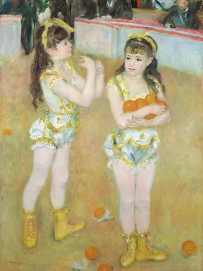 Two girls in acrobatic uniforms stand in an arena, one holds oranges.