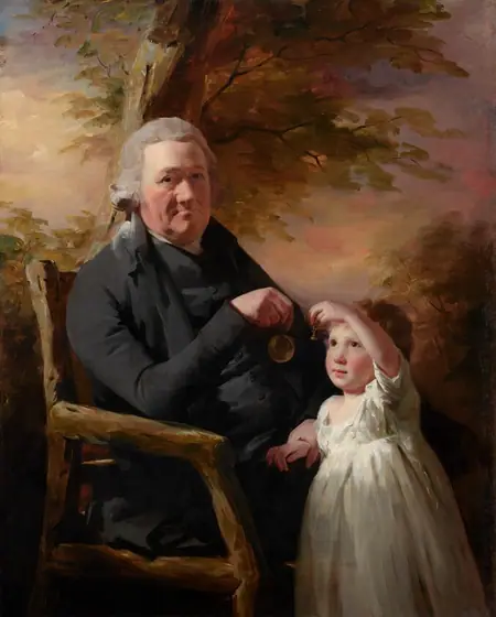Shown from the knees up, an older man sits in a rustic wooden chair and holds up a pocket watch for a young child who stands at his knees in this vertical portrait painting. They both have pale, peachy skin with flushed cheeks.