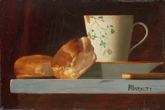 In this painting, there are two round, crusty rolls next to a cream-colored cup with a floral blue-and-yellow design on top of a saucer with a gold rim.