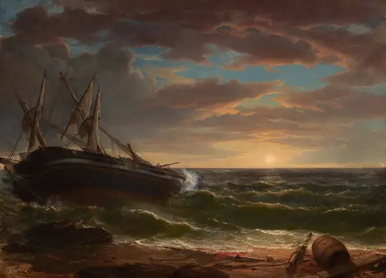 A large, dark sailing ship to our left is stranded near the shore, angled dramatically away from us, in choppy waves under a periwinkle-blue sky streaked with gray and copper-colored clouds in this horizontal painting.