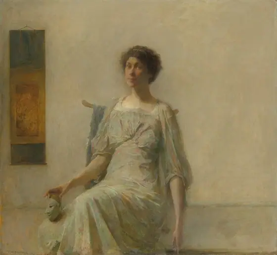 This painting shows a seated woman, her body turned slightly to the left and her head turned towards us. She is holding a small white mask in her right hand, balancing it on one of her knees.
