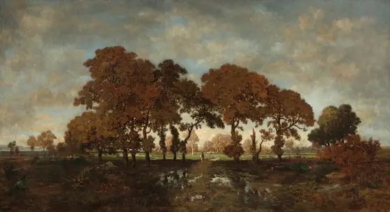 We look across a waterlogged path at a line of rust-red and bronze-brown trees that nearly span the width of this horizontal landscape painting. The scene is loosely painted, which creates a blurred look.