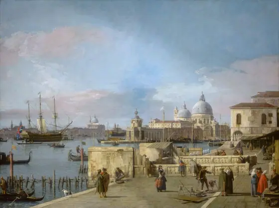 We look slightly down onto a port-side town along a canal, with a church across the water from us in this horizontal landscape painting. A bright blue sky with billowing white, pink, and gray clouds fills the top two-thirds of the painting.