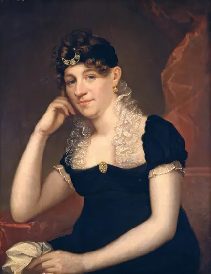 This painting depicts a seated woman from the waist up. She has her right elbow resting on one arm of the red chair that she sits in, with her head leaning on her hand. Her left hand is holding white fabric in her lap.