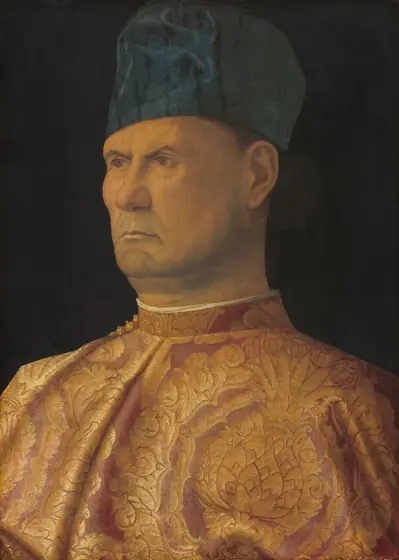 Shown from the chest up against a black background, a man with peachy skin wears a gold and rose-pink cloak in this vertical portrait painting.