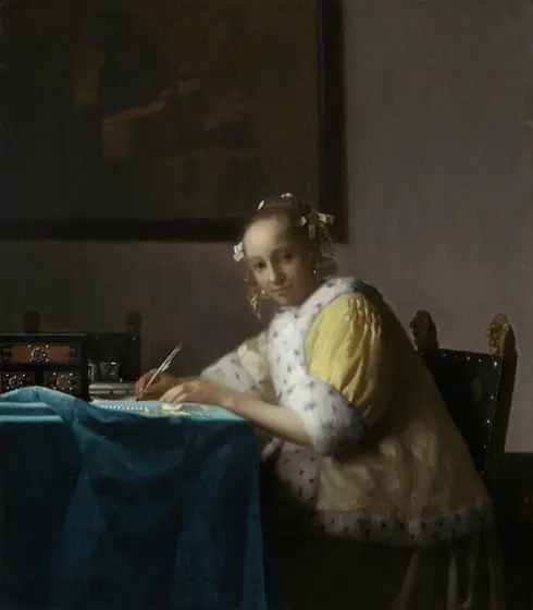 Shown from about the knees up, a pale, smooth-skinned woman in a fur-lined yellow jacket looks out at us as she sits writing at a table in this vertical painting. The woman’s body faces the table to our left.
