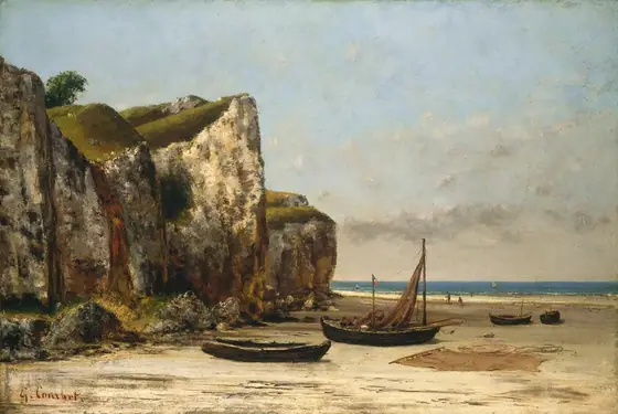 Towering, sheer cliffs loom to our left, over a sunny beach scattered with boats in this horizontal landscape painting.