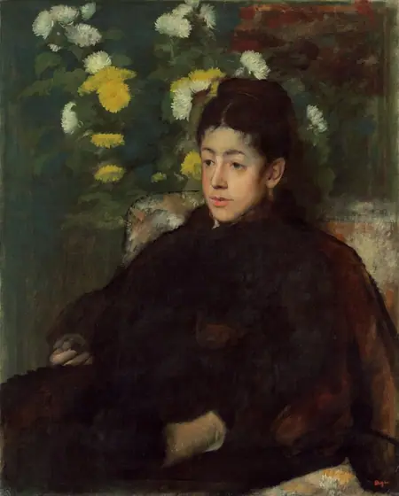 Shown from the lap up, a young woman with pale skin, rosy cheeks, dark eyes, and upswept chestnut-brown hair sits in an upholstered chair angled to our left and she looks in that direction in this vertical portrait painting.
