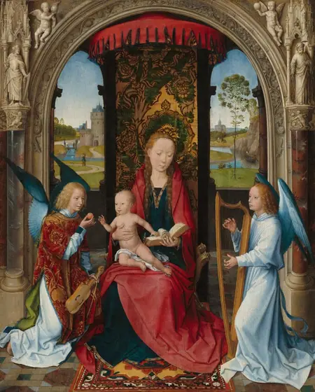 Shown under an ornately carved stone arch, a young woman holds a baby on her lap as she sits on a curving gold chair flanked by two kneeling angels in this vertical painting. All of the people have pale skin.