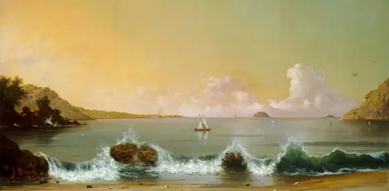 Across a short stretch of sand in front of us, waves of bottle-green water break over two boulders on the shoreline, with sailboats in the water beyond, in this wide, horizontal painting.