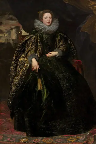 A pale-skinned woman sits on a red velvet chair, which is almost entirely hidden by her voluminous, dark emerald-green and gold gown, in this vertical portrait painting.