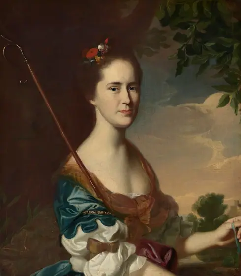 This painting is a portrait of a woman. She has fair skin, a straight nose, and thin red lips, with her dark hair styled up with flowers.