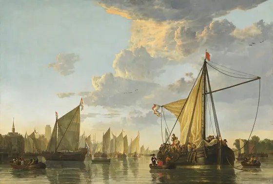 A fleet of ships gathers in a river lined by trees and buildings in this horizontal painting.