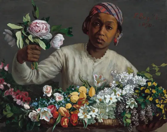 Holding a bunch of peonies in one hand, a woman with brown skin leans forward, toward us from behind a large basket holding dozens of flowers in this horizontal painting.