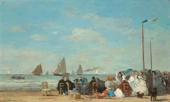 About two dozen men and women sit in straight-backed, wooden chairs gathered along a sandy beach near low, gently breaking waves with sailboats floating in the ocean beyond in this horizontal landscape painting.