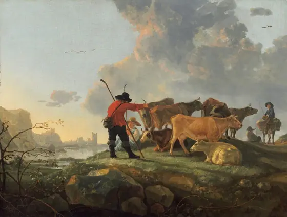A man stands and a woman sits near a herd of seven cows under a light-drenched sky in this horizontal landscape painting. The herd gathers on a grassy rise just beyond some large boulders and twiggy branches.
