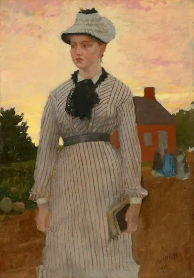 Shown from the knees up, a pale-skinned woman stands close to us with a red schoolhouse in the distance under a sunset sky in this vertical painting.
