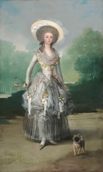 A woman with pale skin, wearing a silvery-gray dress adorned with white ribbons and light pink roses, stands looking out at us with a small, pug dog by her feet in this vertical portrait painting.