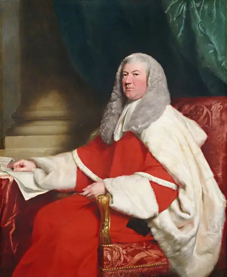 This painting shows a man seated on a decorative red chair, his body turned towards the left and his head turned to look at us. He has a round face, light skin, and gray curly hair that goes down past his shoulders.